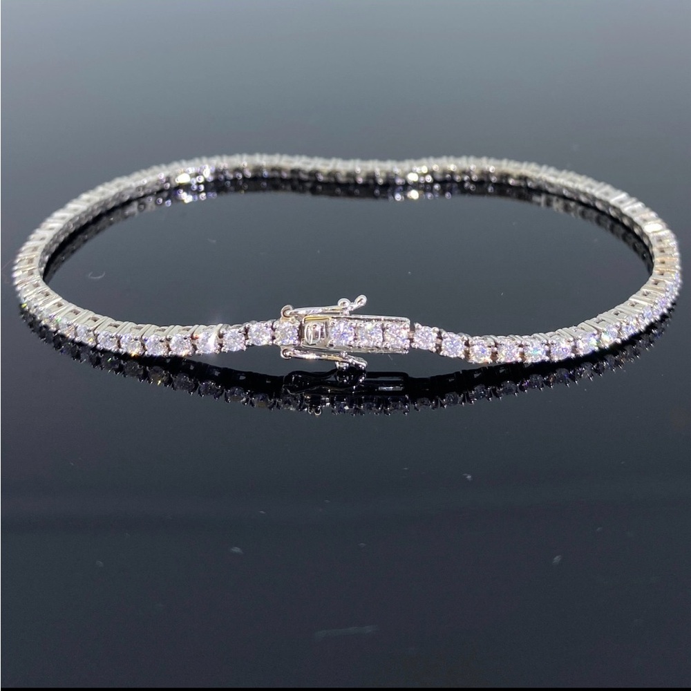 Moissanite and 14k white gold tennis bracelet.